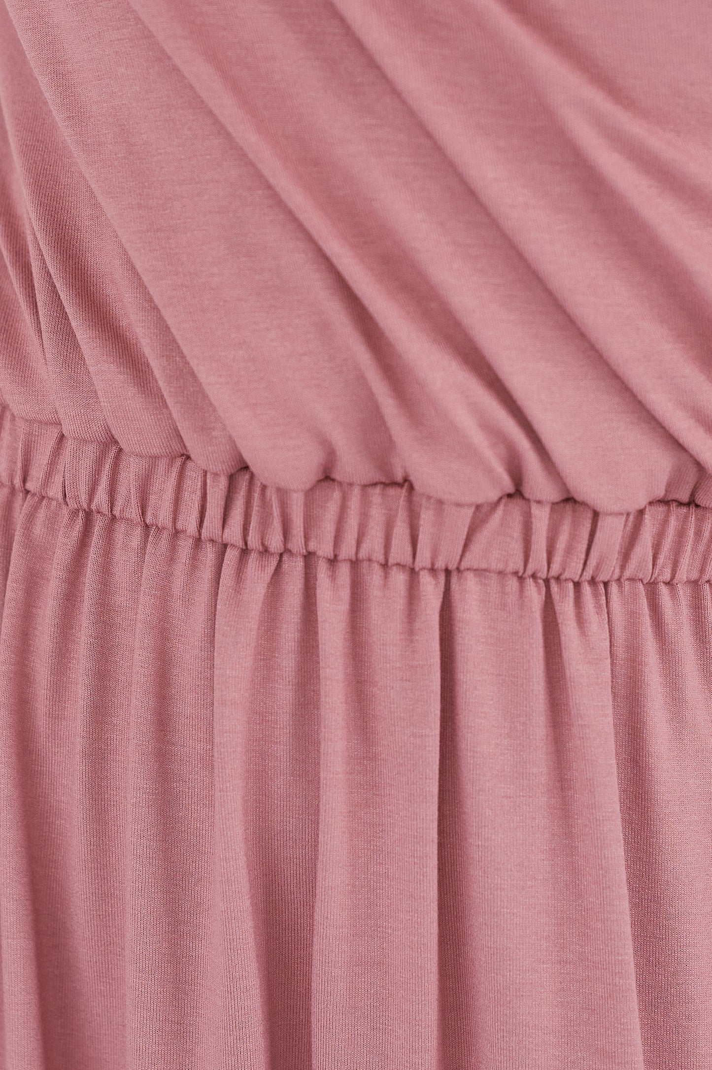 Close-up of a pink fabric with a gathered waistband