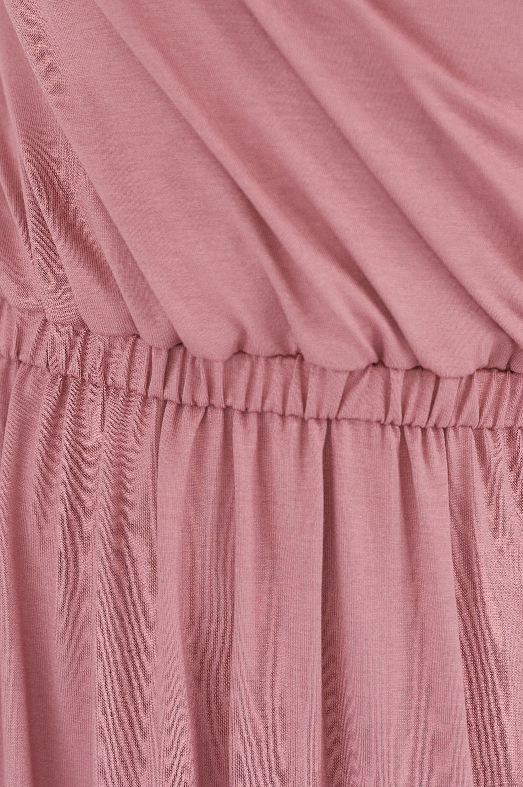 Close-up of a pink fabric with a gathered waistband